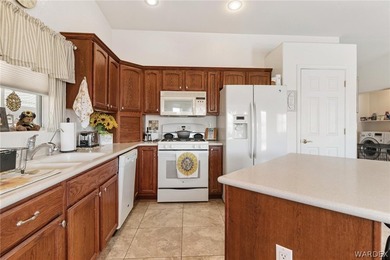 DARLING HOME WITH 3 BEDROOMS, 2 BATHROOMS, PLUS LARGE BONUS ROOM on Desert Lakes Golf Course in Arizona - for sale on GolfHomes.com, golf home, golf lot