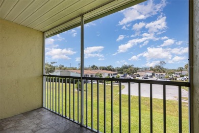 One or more photo(s) has been virtually staged. Charming upper on Capri Isle Golf Club in Florida - for sale on GolfHomes.com, golf home, golf lot