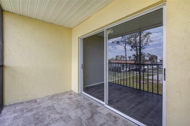 One or more photo(s) has been virtually staged. Charming upper on Capri Isle Golf Club in Florida - for sale on GolfHomes.com, golf home, golf lot