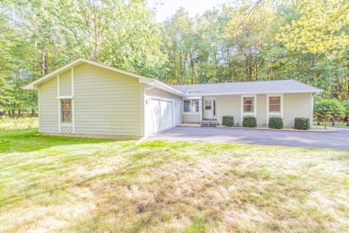 Nestled in a quiet and secluded area of Canadian Lakes, this on Canadian Lakes Country Club-The Royal Course in Michigan - for sale on GolfHomes.com, golf home, golf lot