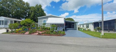 Come settle down and relax in a beautiful, manufactured home on Fairways Country Club in Florida - for sale on GolfHomes.com, golf home, golf lot