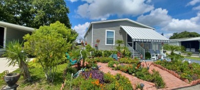 Come settle down and relax in a beautiful, manufactured home on Fairways Country Club in Florida - for sale on GolfHomes.com, golf home, golf lot