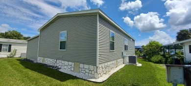 Come settle down and relax in a beautiful, manufactured home on Fairways Country Club in Florida - for sale on GolfHomes.com, golf home, golf lot