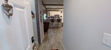 Come settle down and relax in a beautiful, manufactured home on Fairways Country Club in Florida - for sale on GolfHomes.com, golf home, golf lot