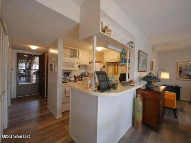 THIS UNFURNISHED 1 BEDROOM CONDO IS ON THE FIRST FLOOR AND on Diamondhead Country Club in Mississippi - for sale on GolfHomes.com, golf home, golf lot