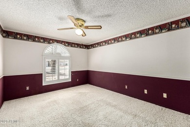 Expansive backyard with extended covered patio highlights this on Cottonwood Country Club in Arizona - for sale on GolfHomes.com, golf home, golf lot