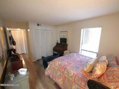THIS UNFURNISHED 1 BEDROOM CONDO IS ON THE FIRST FLOOR AND on Diamondhead Country Club in Mississippi - for sale on GolfHomes.com, golf home, golf lot