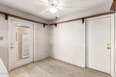 Expansive backyard with extended covered patio highlights this on Cottonwood Country Club in Arizona - for sale on GolfHomes.com, golf home, golf lot