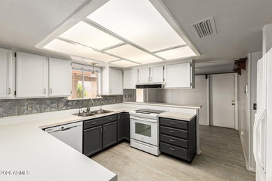 Expansive backyard with extended covered patio highlights this on Cottonwood Country Club in Arizona - for sale on GolfHomes.com, golf home, golf lot