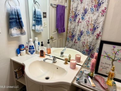 THIS UNFURNISHED 1 BEDROOM CONDO IS ON THE FIRST FLOOR AND on Diamondhead Country Club in Mississippi - for sale on GolfHomes.com, golf home, golf lot