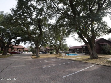 THIS UNFURNISHED 1 BEDROOM CONDO IS ON THE FIRST FLOOR AND on Diamondhead Country Club in Mississippi - for sale on GolfHomes.com, golf home, golf lot