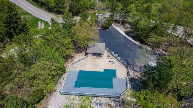 Experience elevated lakefront living at Lake of the Ozarks! One on Seasons Ridge At Four Seasons in Missouri - for sale on GolfHomes.com, golf home, golf lot