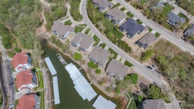 Experience elevated lakefront living at Lake of the Ozarks! One on Seasons Ridge At Four Seasons in Missouri - for sale on GolfHomes.com, golf home, golf lot