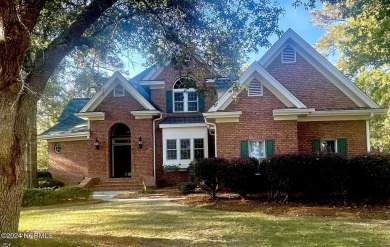 Discover luxury living in this exquisite 4-bedroom, 3-bath home on Ocean Ridge Plantation in North Carolina - for sale on GolfHomes.com, golf home, golf lot