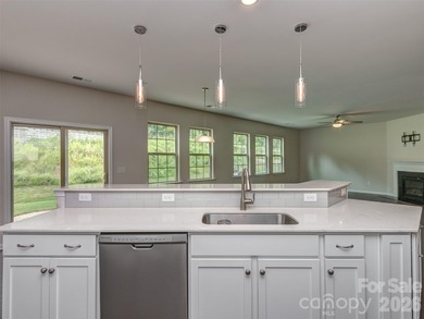 Welcome home to Killian Creek! Large, rocking chair, covered on Verdict Ridge Golf and Country Club in North Carolina - for sale on GolfHomes.com, golf home, golf lot