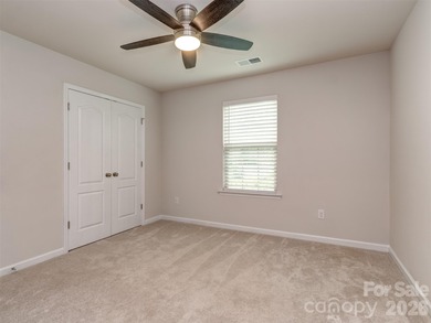 Welcome home to Killian Creek! Large, rocking chair, covered on Verdict Ridge Golf and Country Club in North Carolina - for sale on GolfHomes.com, golf home, golf lot