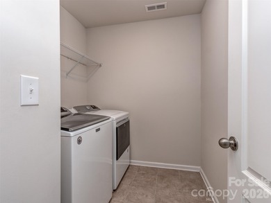 Welcome home to Killian Creek! Large, rocking chair, covered on Verdict Ridge Golf and Country Club in North Carolina - for sale on GolfHomes.com, golf home, golf lot