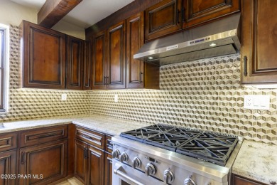 Discover a rare fusion of old-world elegance & cutting-edge on StoneRidge Golf Course in Arizona - for sale on GolfHomes.com, golf home, golf lot