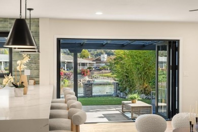 Live lakeside luxury every day in this breathtakingly remodeled on Lake San Marcos Country Club- South Course in California - for sale on GolfHomes.com, golf home, golf lot