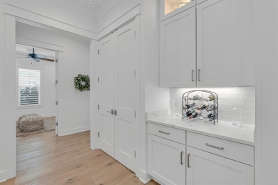 This elegant single-story Hawthorne plan by Huff Homes combines on Origins Golf Club in Florida - for sale on GolfHomes.com, golf home, golf lot