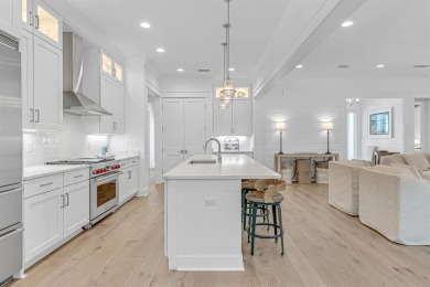 This elegant single-story Hawthorne plan by Huff Homes combines on Origins Golf Club in Florida - for sale on GolfHomes.com, golf home, golf lot