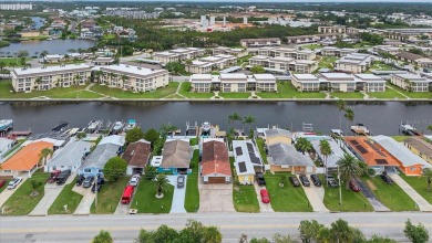 Welcome to your gorgeous coastal retreat!  This beautifully on Gulf Harbors Golf Course in Florida - for sale on GolfHomes.com, golf home, golf lot