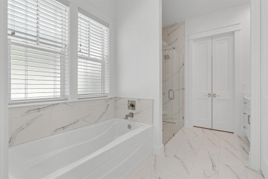 This elegant single-story Hawthorne plan by Huff Homes combines on Origins Golf Club in Florida - for sale on GolfHomes.com, golf home, golf lot