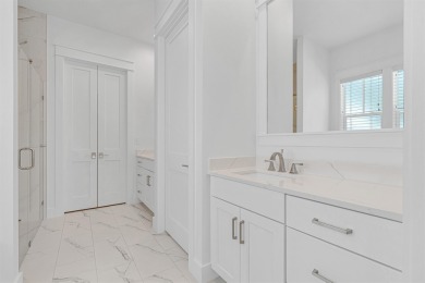 This elegant single-story Hawthorne plan by Huff Homes combines on Origins Golf Club in Florida - for sale on GolfHomes.com, golf home, golf lot
