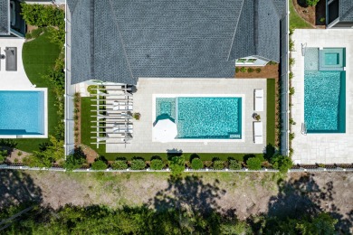 This elegant single-story Hawthorne plan by Huff Homes combines on Origins Golf Club in Florida - for sale on GolfHomes.com, golf home, golf lot