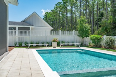 This elegant single-story Hawthorne plan by Huff Homes combines on Origins Golf Club in Florida - for sale on GolfHomes.com, golf home, golf lot