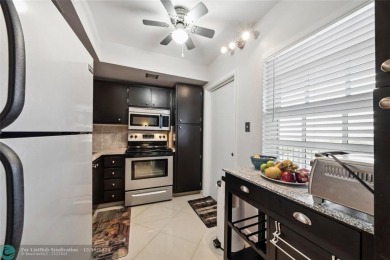 Enjoy golf views from a private screened patio in this updated on Palm-Aire Country Club and Resort - The Oaks in Florida - for sale on GolfHomes.com, golf home, golf lot