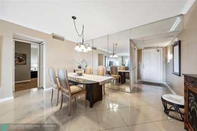 Enjoy golf views from a private screened patio in this updated on Palm-Aire Country Club and Resort - The Oaks in Florida - for sale on GolfHomes.com, golf home, golf lot