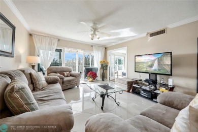 Enjoy golf views from a private screened patio in this updated on Palm-Aire Country Club and Resort - The Oaks in Florida - for sale on GolfHomes.com, golf home, golf lot