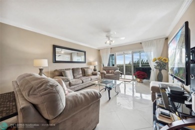 Enjoy golf views from a private screened patio in this updated on Palm-Aire Country Club and Resort - The Oaks in Florida - for sale on GolfHomes.com, golf home, golf lot