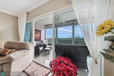 Enjoy golf views from a private screened patio in this updated on Palm-Aire Country Club and Resort - The Oaks in Florida - for sale on GolfHomes.com, golf home, golf lot