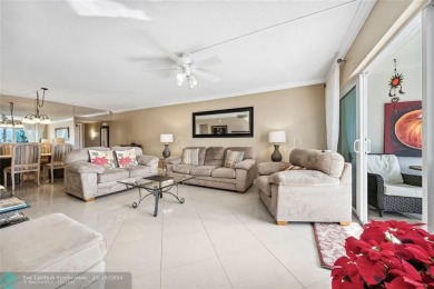 Enjoy golf views from a private screened patio in this updated on Palm-Aire Country Club and Resort - The Oaks in Florida - for sale on GolfHomes.com, golf home, golf lot