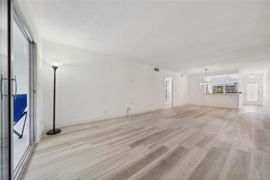 Stunning unit in Wynmoor! Overlooking scenic golf course, this on Wynmoor Golf Course in Florida - for sale on GolfHomes.com, golf home, golf lot