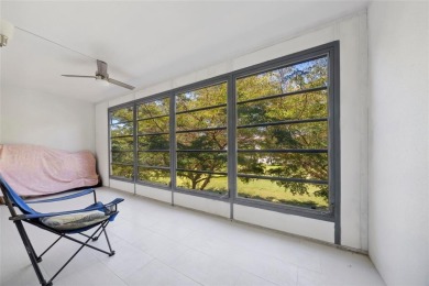 Stunning unit in Wynmoor! Overlooking scenic golf course, this on Wynmoor Golf Course in Florida - for sale on GolfHomes.com, golf home, golf lot