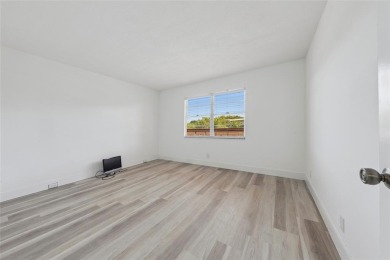 Stunning unit in Wynmoor! Overlooking scenic golf course, this on Wynmoor Golf Course in Florida - for sale on GolfHomes.com, golf home, golf lot