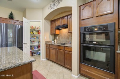 This gorgeous 4 bedroom, 3 bath home with a pool in the growing on The Golf Club At Johnson Ranch in Arizona - for sale on GolfHomes.com, golf home, golf lot