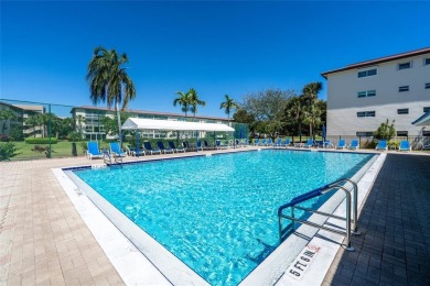 Stunning unit in Wynmoor! Overlooking scenic golf course, this on Wynmoor Golf Course in Florida - for sale on GolfHomes.com, golf home, golf lot