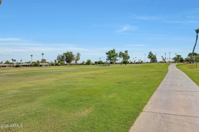 The Brick Driveway Welcomes You To An Enclosed Courtyard on Sun City Lakes West and East in Arizona - for sale on GolfHomes.com, golf home, golf lot
