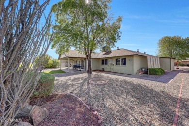 The Brick Driveway Welcomes You To An Enclosed Courtyard on Sun City Lakes West and East in Arizona - for sale on GolfHomes.com, golf home, golf lot