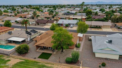 The Brick Driveway Welcomes You To An Enclosed Courtyard on Sun City Lakes West and East in Arizona - for sale on GolfHomes.com, golf home, golf lot