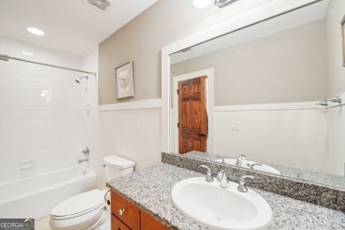 Welcome to 1259 Birch River Drive, a unique masterpiece nestled on Achasta Golf Club in Georgia - for sale on GolfHomes.com, golf home, golf lot