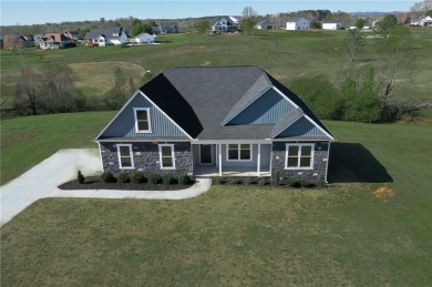 Come check out this beautiful 3 bed 2 bath plus bonus room above on Falcons Lair Golf Club in South Carolina - for sale on GolfHomes.com, golf home, golf lot