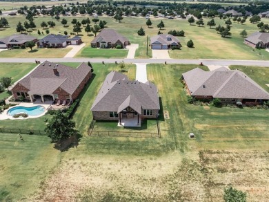Gorgeous home located on the 15th hole of Cimarron National Golf on Cimarron National Golf Club in Oklahoma - for sale on GolfHomes.com, golf home, golf lot
