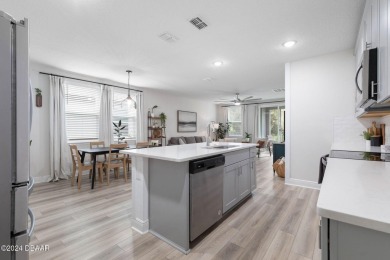 Welcome to 118 Pitching Wedge Drive, a stunning 2023-built home on LPGA International Golf Course in Florida - for sale on GolfHomes.com, golf home, golf lot