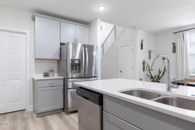 Welcome to 118 Pitching Wedge Drive, a stunning 2023-built home on LPGA International Golf Course in Florida - for sale on GolfHomes.com, golf home, golf lot
