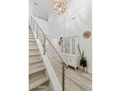Welcome to 118 Pitching Wedge Drive, a stunning 2023-built home on LPGA International Golf Course in Florida - for sale on GolfHomes.com, golf home, golf lot